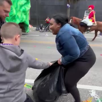 Woman snatches bag of toys from birthday boy at Mardi Gras