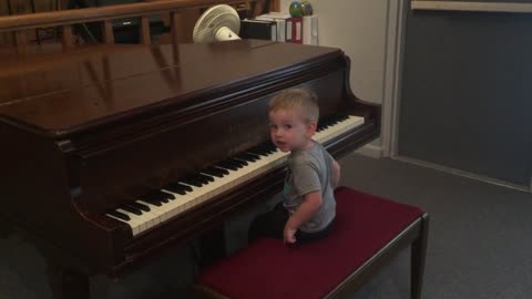 Grandson on the piano at church as a baby