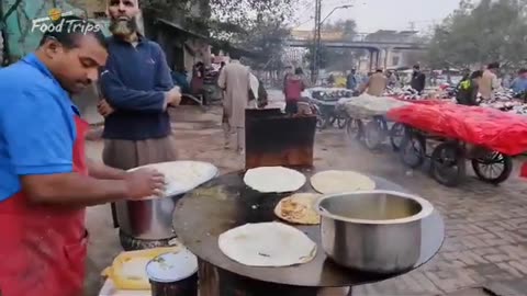 35 year old Ahmad saag alu paratha Ek moria pull Opposite yakki gate Lahore Pakistan in food street