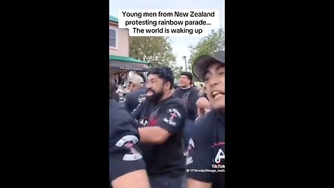 New Zealand men protest a rainbow parade