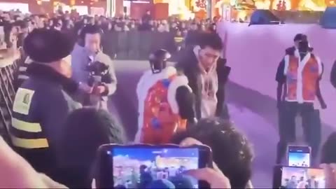 AI robot tries to attack crowd of people in China.