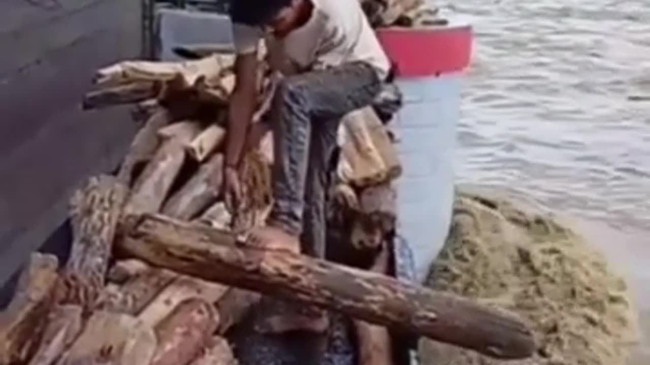 Insane River Risk: Man Spears WHAT in Raging Waters?!