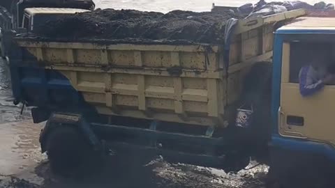 trucks loaded with sand cannot handle slippery roads