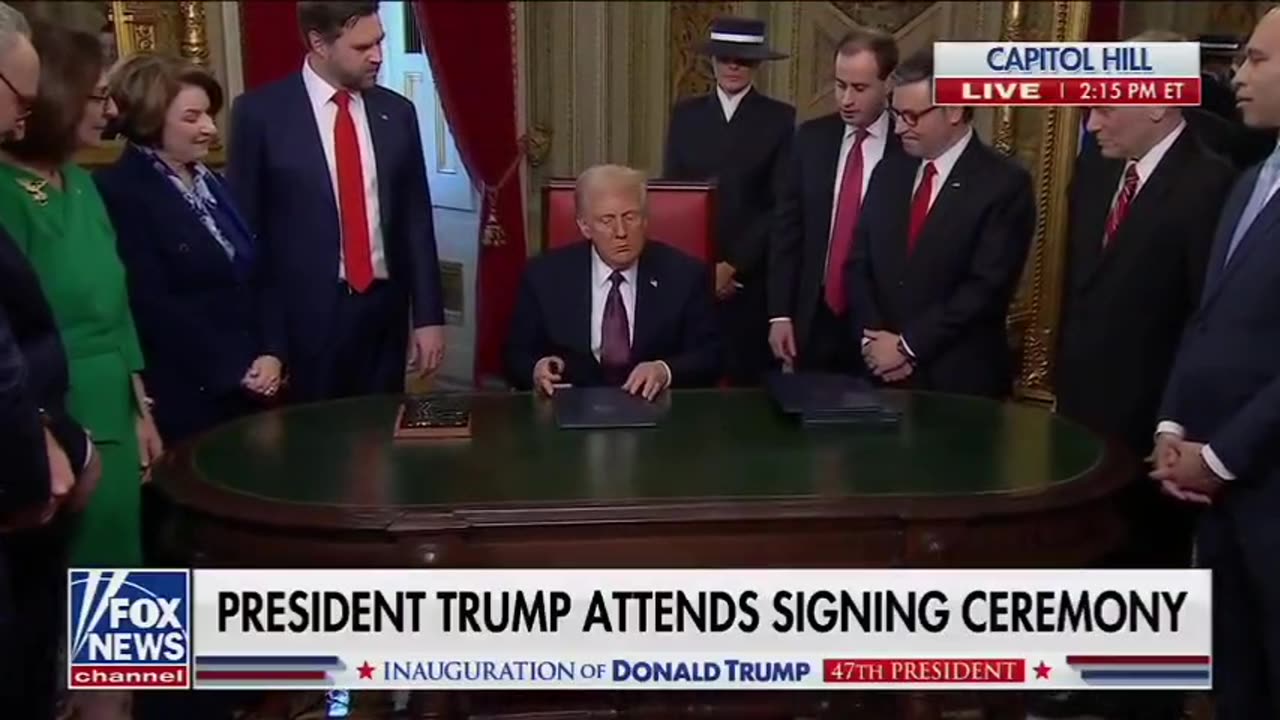 President Donald Trump signs the first executive orders of his term