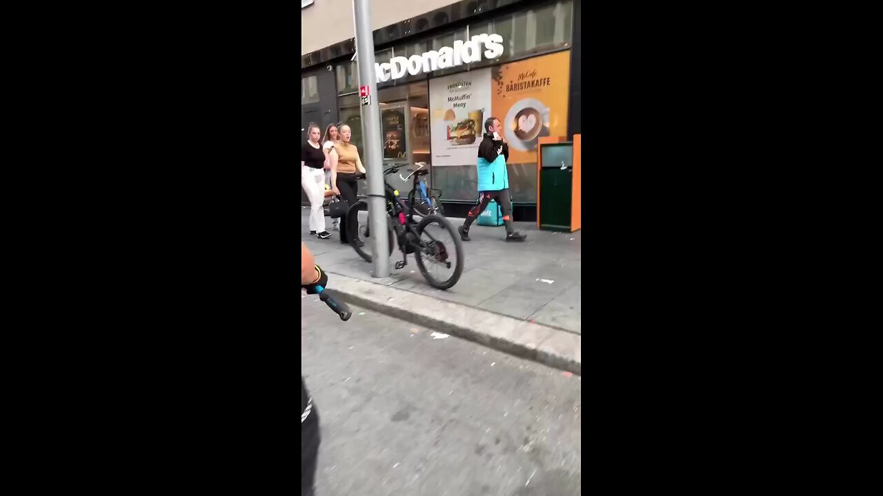 The policeman is taking out a bicycle.