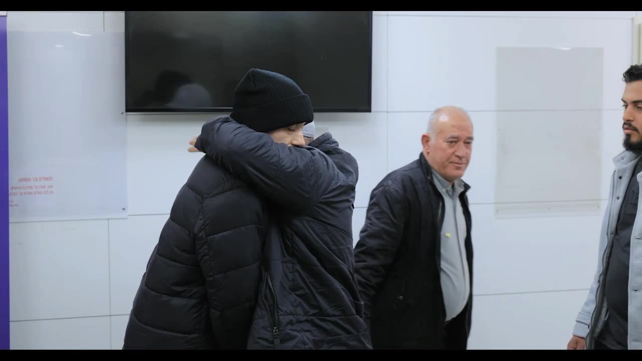 Released hostage Hisham al-Sayed reunites with family members at Ichilov hospital.