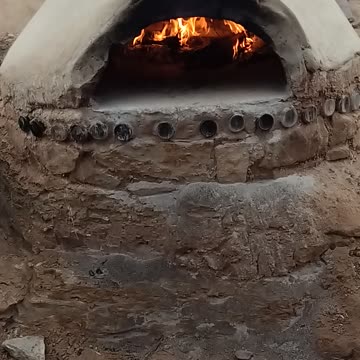 Sandstone and Clay Pizza oven warming up