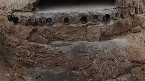 Sandstone and Clay Pizza oven warming up