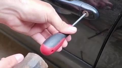 Locked out of your car? Some say a screwdriver, hammer, and wire are all you need! 🛠️🚗 😅