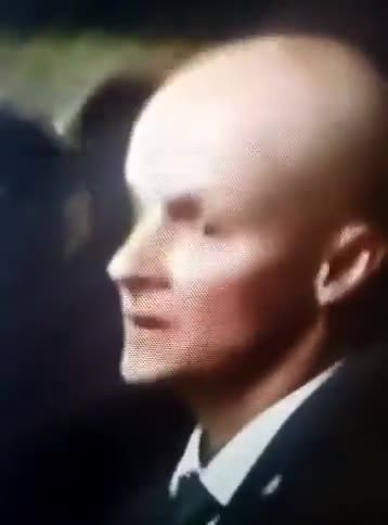 Alien Shapeshifter is seen in a courtroom during trial