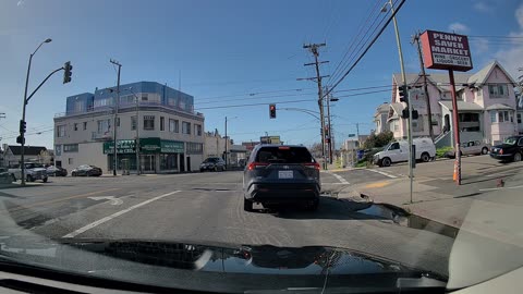 Backward Driver Speeds Through Red Light