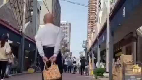 A man walking his tortoise