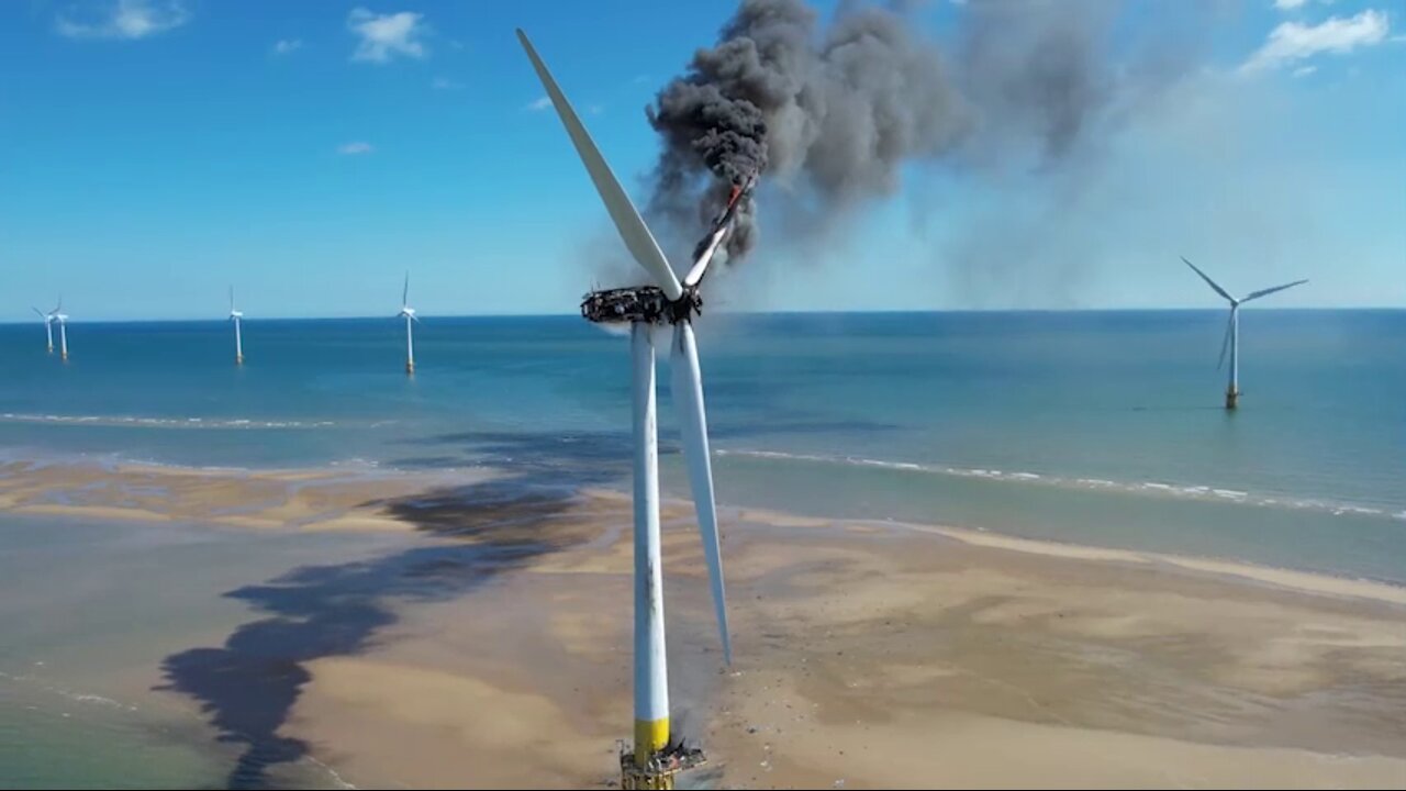 A wind turbine catches fire off the British coast, releasing thick black toxic fumes into the air