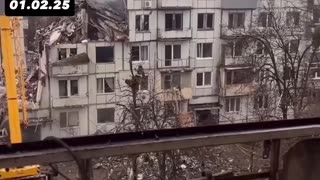 Woman shows damaged apartment after Russian missile explosion in Poltava