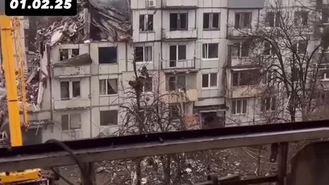 Woman shows damaged apartment after Russian missile explosion in Poltava