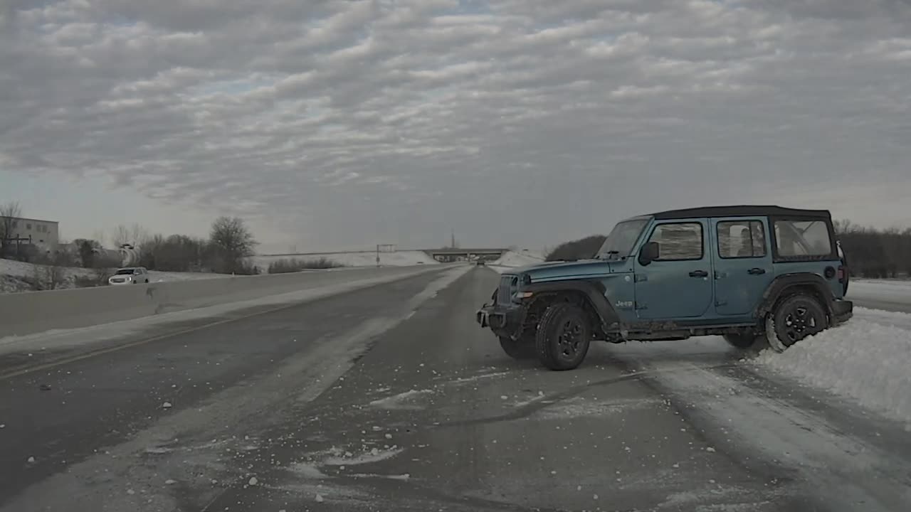 Jeep Loses Control on Slippery Road