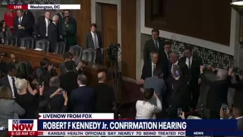 RFK Jr walks in to cheers at his confirmation hearing