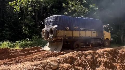 the truck swerved on the muddy road