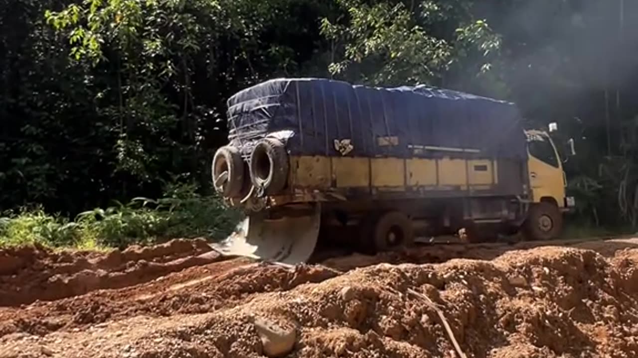 the truck swerved on the muddy road