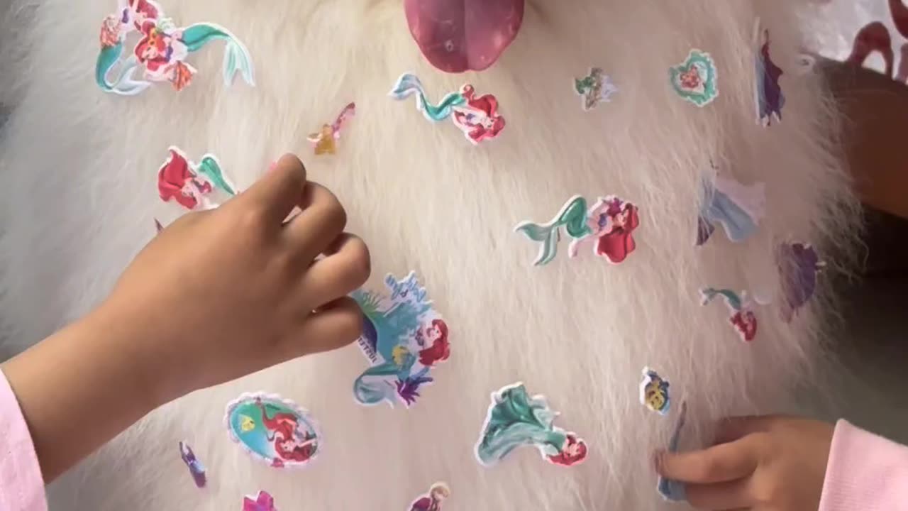 cute dog play with little princes