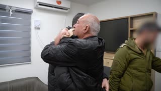 Released hostage Hisham al-Sayed is seen reuniting with his father Shaaban