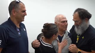 Released hostage Gadi Mozes meets his children at an IDF facility near the Gaza