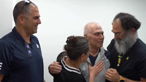 Released hostage Gadi Mozes meets his children at an IDF facility near the Gaza