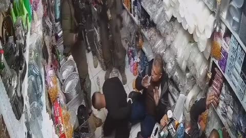 Israeli forces raided a commercial shop and arrested a Palestinian boy