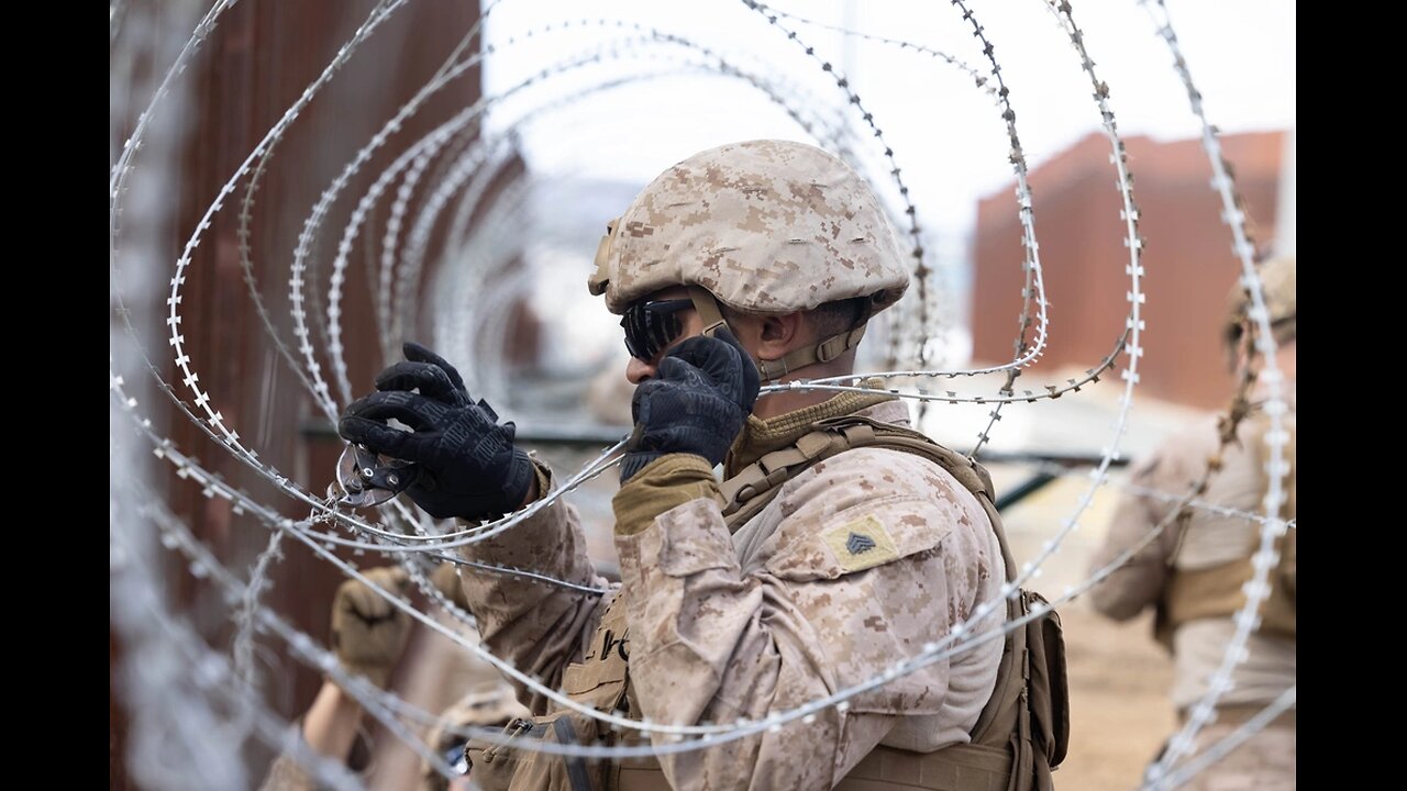 US Marines install concertina wire on the southern border wall in California