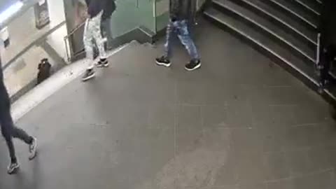 Migrant kicks a woman off stairs for no reason