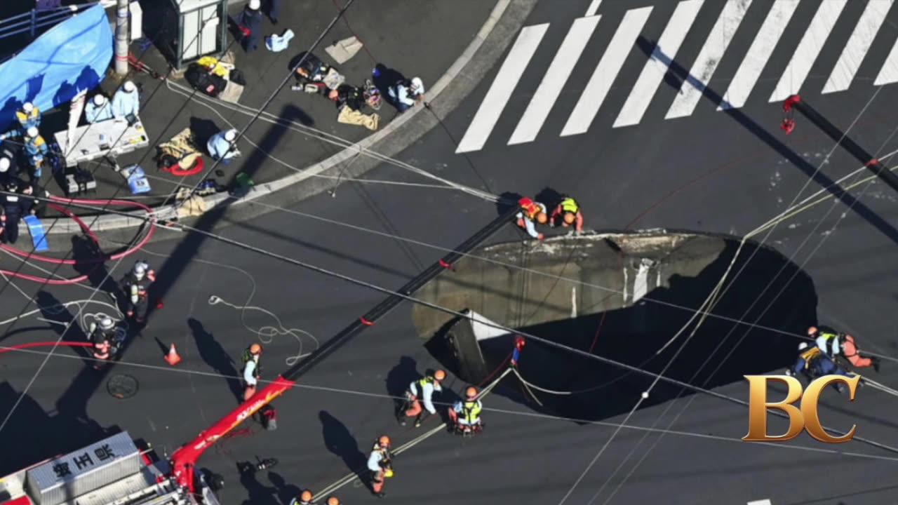 Swimming pool-sized sinkhole swallows truck in Japan, trapping driver inside