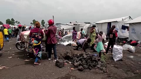 People flee in overcrowded boats as Congo rebels seize town