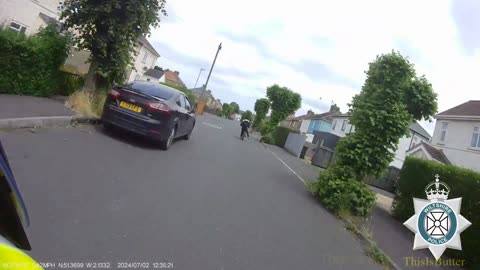 Two people on a bicycle fleeing from police, crashes into a wall