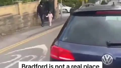 Uk police officer on bike circling car