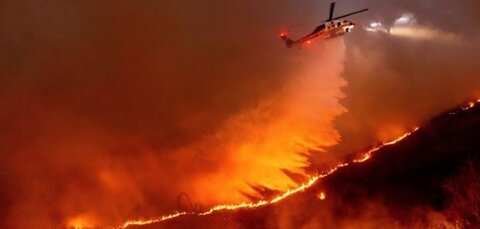 Helicopters battle flames as Palisades Fire burns on Santa Monica Mountains