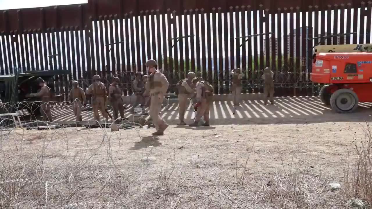 U.S. Marines deploy concertina wire along southern border wall during security mission