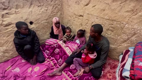 Gazan father digs under tent to protect children from Israeli strikes