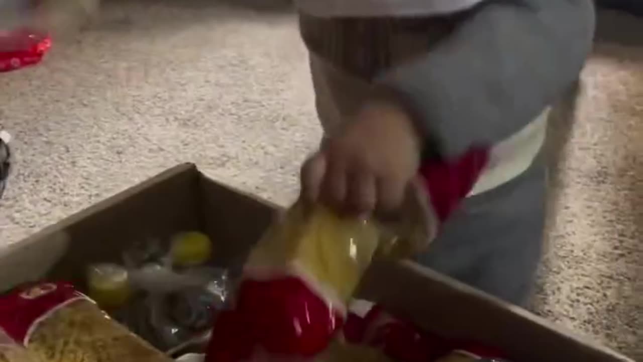A little boy in North Gaza, baby Ismail, is overjoyed as he receives an aid package