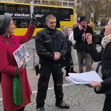 🇩🇪Pro-Palestine activist in Germany gets triggered by a woman silently protesting