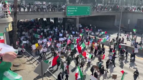 A large group of illegal immihrant protesters have shut down Freeway near