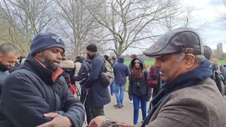 Speakers Corner - Uncle Sam with Muslims talking about various topics, like Muha