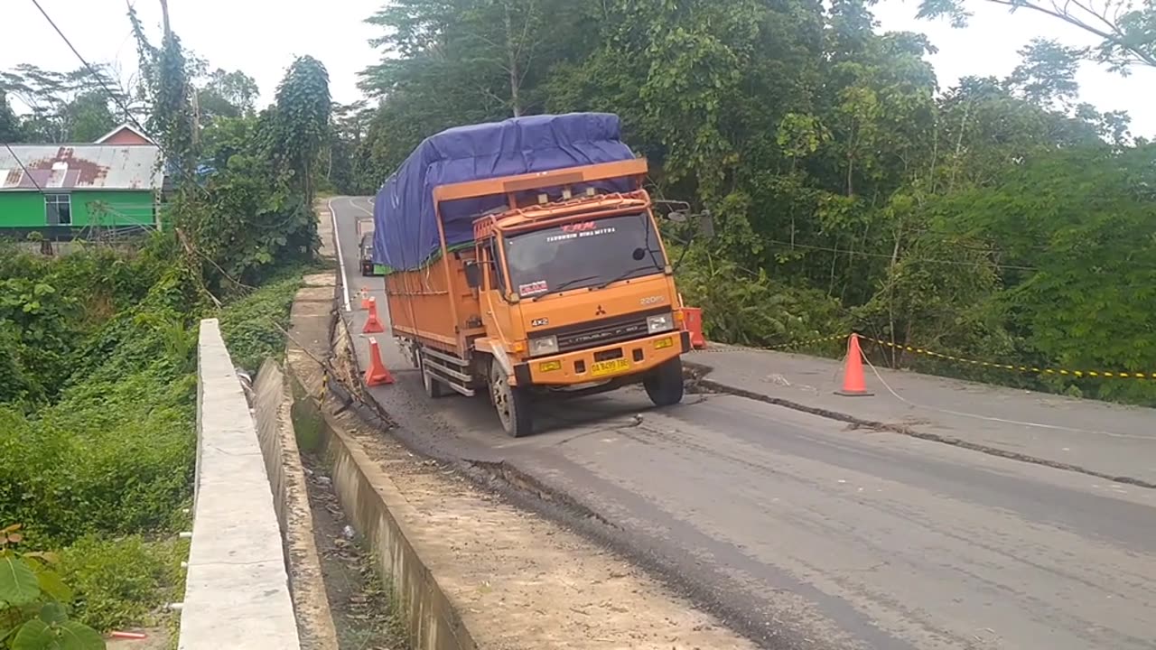 heavy-duty trucks drive over sloping roads
