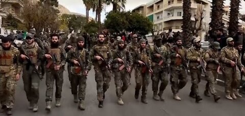 Hundreds of Syrian armed rebels parade in Damascus streets as a show of force