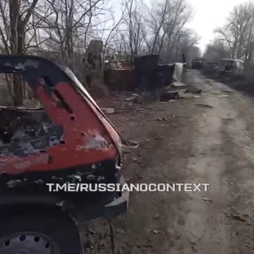 Russian Soldiers Walking Down Road in Kursk Lined with Dozens of Destroyed Russian Vehicles