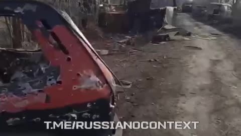 Russian Soldiers Walking Down Road in Kursk Lined with Dozens of Destroyed Russian Vehicles