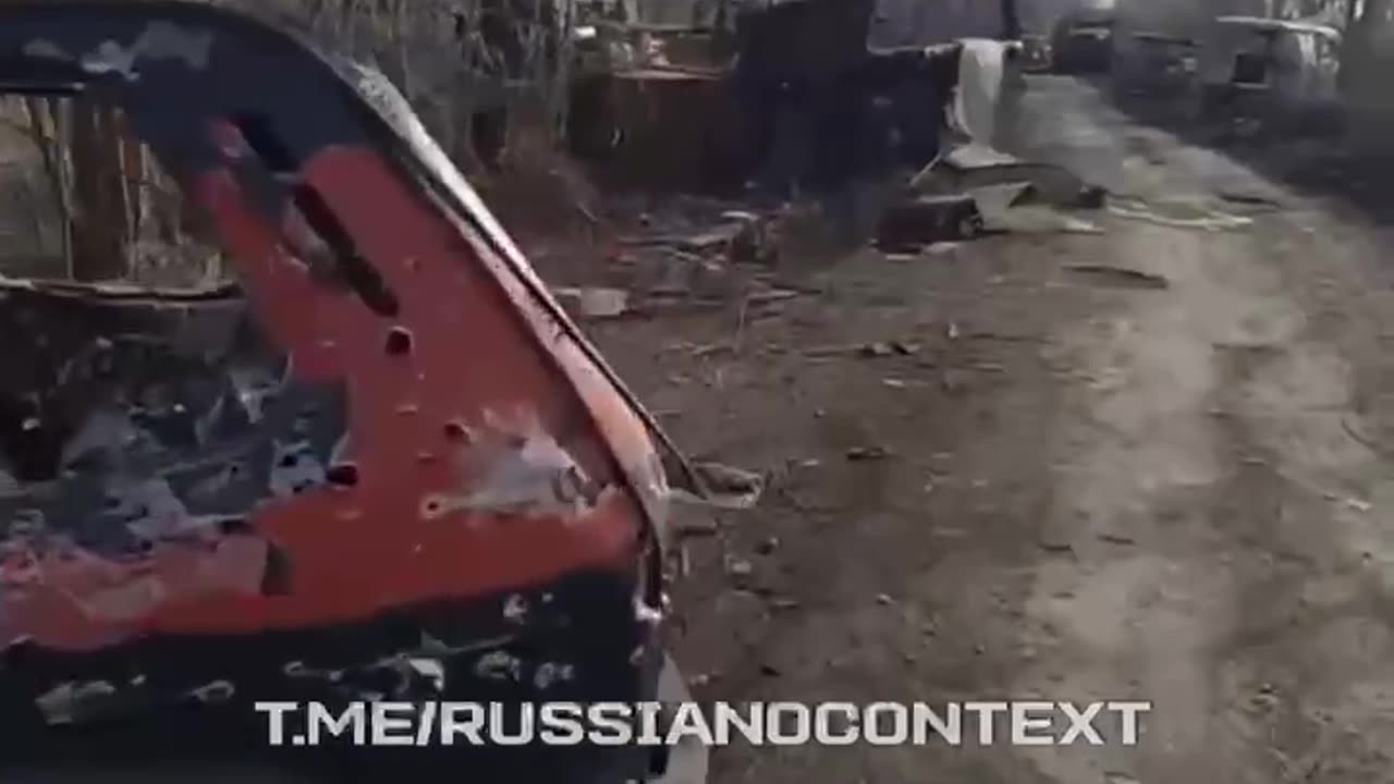 Russian Soldiers Walking Down Road in Kursk Lined with Dozens of Destroyed Russian Vehicles