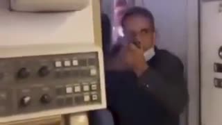 Air marshal pulls out a gun after passengers attempted to enter the cockpit to argue with pilots