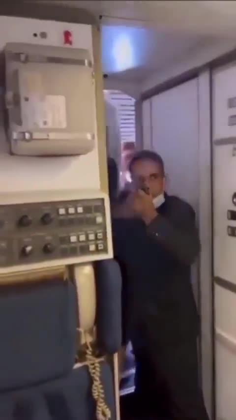 Air marshal pulls out a gun after passengers attempted to enter the cockpit to argue with pilots