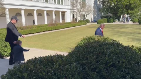 Elon Musk and his son Lil X join President Trump as he buys a new Tesla outside The White House.