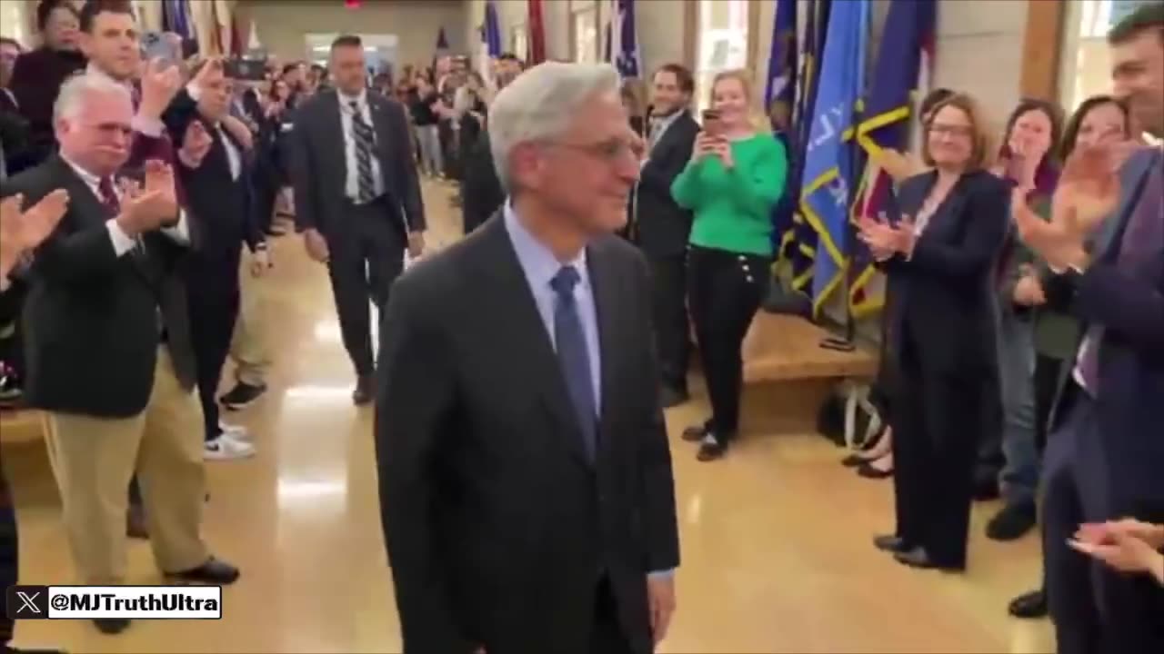 Merrick Garland receives a big round of applause for his exit at the DOJ.